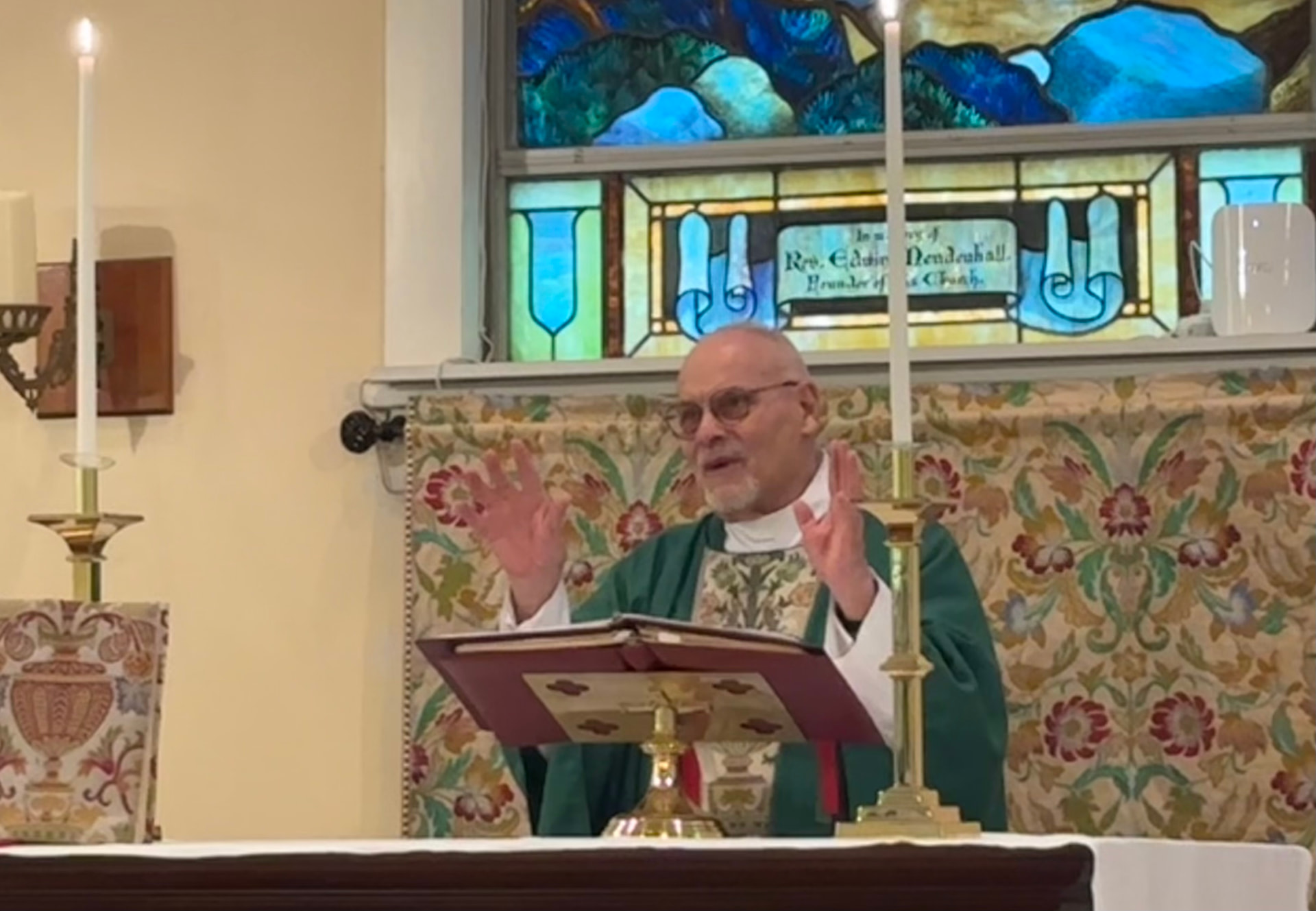 The Rev'd Ronald R. Miller preaching at the altar
